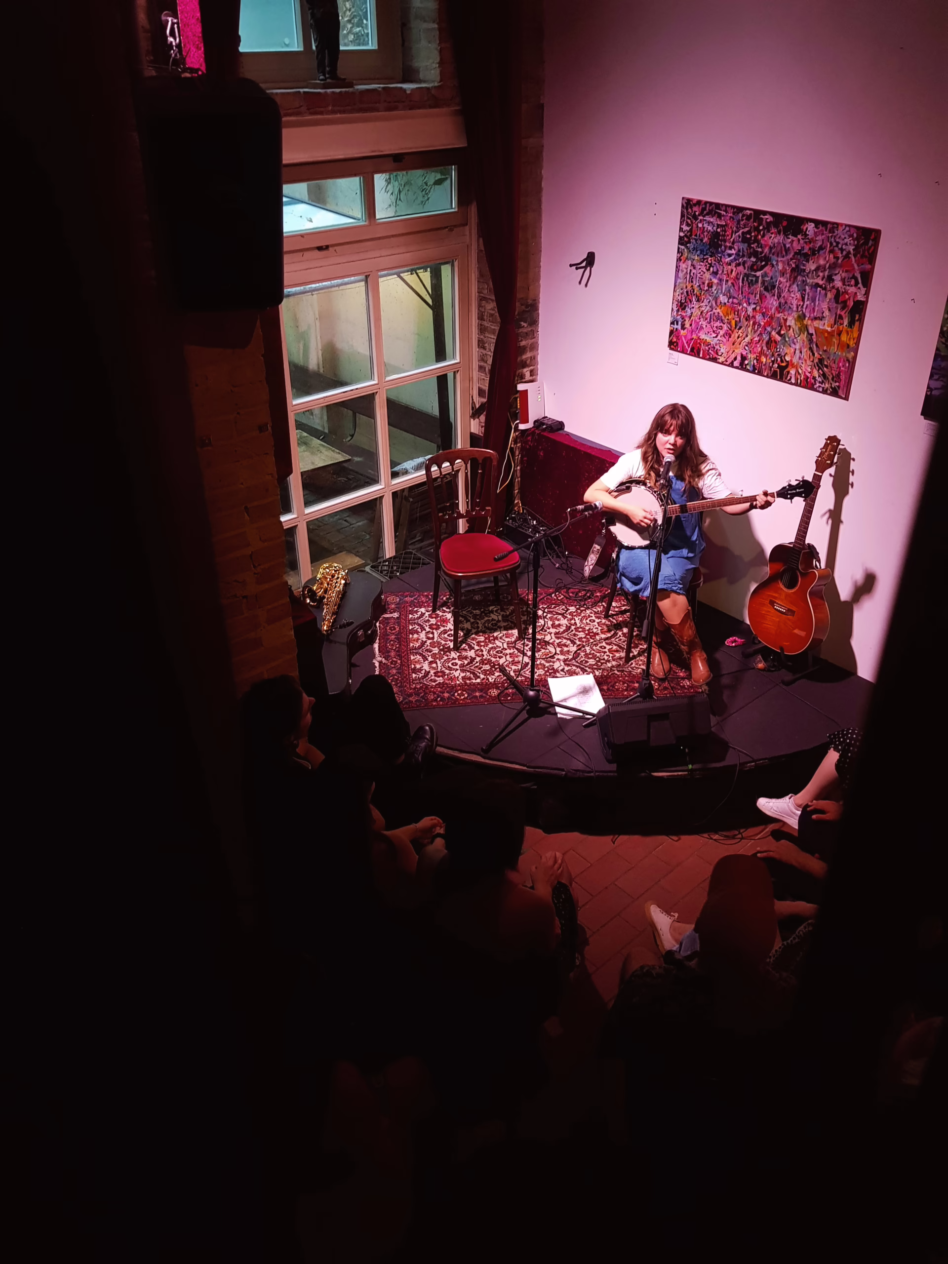 YENI EP Release show playing banjo aerial shot